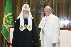 Pope Francis and the head of the Russian Orthodox Church Patriarch Kirill pose for photos before their meeting at the Jose Marti aiport in Havana, Cuba, Friday, Feb. 12, 2016. This is the first-ever papal meeting with the head of the Russian Orthodox Church, a historic development in the 1,000-year schism within Christianity. (Ismael Francisco/Cubadebate via AP)